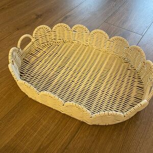 Cream colored scalloped wicker tray/basket